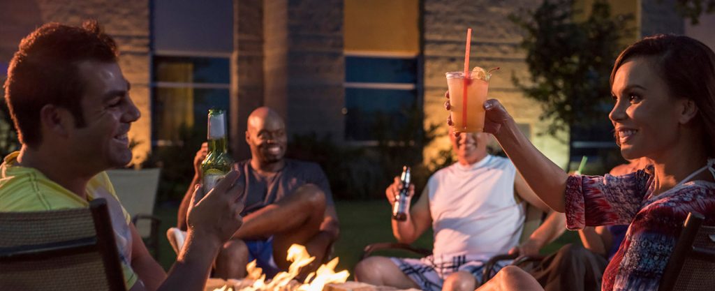 Friends enjoying a night outside during their weekend getaway