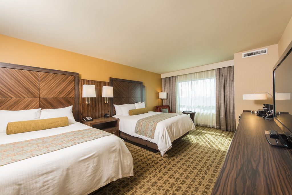 Spacious double bed layout at the Apache Casino Hotel