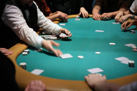 An Apache dealing handing out cards to play poker